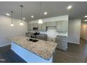 Spacious kitchen with granite countertops, a large center island, and modern gray cabinets at 346 Olivia Crossing Ct # 12, Four Oaks, NC 27524