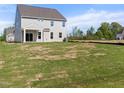 Expansive backyard with lush green grass offers plenty of space for outdoor activities and relaxation at 1224 Cricket St, Elon, NC 27244