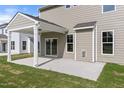 Covered patio area is perfect for outdoor entertaining and seamlessly extends the living space at 1224 Cricket St, Elon, NC 27244