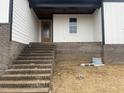 Brick stairs leading to the front door with a covered porch at 196 Hook Dr # 9, Fuquay Varina, NC 27526