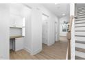 Bright hallway with built-in desk and access to other rooms at 329 & 331 Roxboro St, Haw River, NC 27258