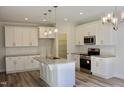 Contemporary kitchen featuring white cabinets, stainless steel appliances, and granite countertops at 59 Mossy Bridge Ct, Lillington, NC 27546
