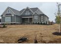 Inviting home featuring neutral siding and architectural roof detail at 70 Water Willow Ln, Zebulon, NC 27597