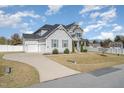 Spacious two-story home with an attached two-car garage and long driveway at 1024 Jarrett Bay Rd, Willow Springs, NC 27592