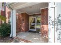 Brick building exterior with covered entryway and landscaping at 413 Glencrest Pl, Chapel Hill, NC 27514