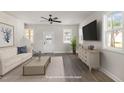 Staged living room boasts modern decor, neutral colors, and plenty of natural light at 50 N Rowsham Pl, Smithfield, NC 27577