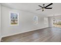 Bright, open living area features neutral walls, wood-look flooring, and ample natural light at 50 N Rowsham Pl, Smithfield, NC 27577