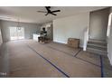 Open living room with kitchen island and stairs at 50 N Rowsham Pl, Smithfield, NC 27577