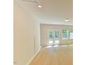 Bright and airy living area features hardwood floors, recessed lighting, and windows letting in natural light at 140 Norwell Ln, Pittsboro, NC 27312