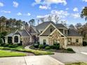 Elegant home with stone and shingle accents, nicely landscaped at 110 Bywater Way, Chapel Hill, NC 27516
