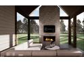 Inviting screened porch with a fireplace, comfortable seating, and a beautiful outdoor view at 1306 Lennox Pl, Raleigh, NC 27612