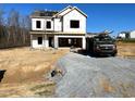 Two-story house under construction, with gray shingle roof and a gravel driveway at 1234 Oriental St # 168, Angier, NC 27501