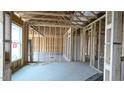 Open floor plan with new home framing and a large window at 1529 Pecan Drive Dr # 32, Nashville, NC 27856