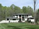 Beautiful new construction home with a spacious yard, and wooded backdrop at 196 Mountaintop Cir, Pittsboro, NC 27312