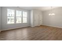 Bright, open living room featuring hardwood floors and large windows at 255 Chesapeake Commons St # 90, Garner, NC 27529