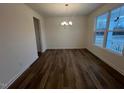 Bright dining room with hardwood floors and large windows at 432 Old Fashioned Way, Lillington, NC 27546