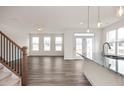 Bright living room with hardwood floors and access to the kitchen at 432 Old Fashioned Way, Lillington, NC 27546