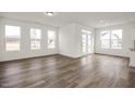 Open living room with hardwood floors and access to a back deck at 432 Old Fashioned Way, Lillington, NC 27546