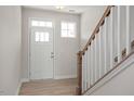Bright entryway with hardwood floors and a staircase at 65 Wild Turkey Way Way, Lillington, NC 27546