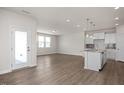 Open living room with hardwood floors and access to a deck at 65 Wild Turkey Way Way, Lillington, NC 27546