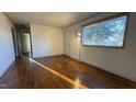 Living room featuring hardwood floors and hallway access at 720 Darby St, Raleigh, NC 27610