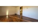 Bright living room with hardwood floors and view into kitchen at 720 Darby St, Raleigh, NC 27610