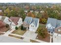 A beautiful home with mature landscaping and backyard views of the fall foliage at 722 Redford Place Dr, Rolesville, NC 27571