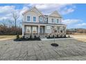 Charming two-story home with stone and siding exterior and well-maintained landscaping at 87 Browning Mill Dr, Wendell, NC 27591