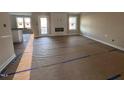 Spacious living area with hardwood floors and a fireplace at 210 Maxwell Farm Ln, Selma, NC 27576