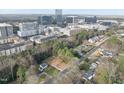 Aerial view of a vacant lot for sale in established neighborhood with nearby cityscape in the distance at 216 Dartmouth Rd, Raleigh, NC 27609