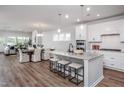 Open concept kitchen with island, stainless steel appliances, and granite countertops at 257 Circle City Way, Pittsboro, NC 27312