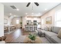 Open concept living room, kitchen, and dining area with hardwood floors at 43 Olde Place Dr, Zebulon, NC 27597