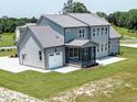 Spacious backyard with a screened porch, and an attached garage on a well maintained lot at 20 Water Willow Ln, Zebulon, NC 27597