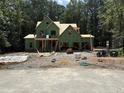 Two story house under construction showcasing the frame and construction crew at 5100 Grist Stone Way, Youngsville, NC 27596