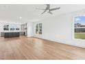 Spacious living room with hardwood floors and lots of natural light at 444 Billingshurst Way, Knightdale, NC 27545