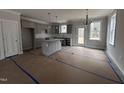 Modern kitchen with gray cabinets and island at 39 N Rowsham Pl, Smithfield, NC 27577