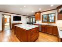 Bright kitchen featuring modern appliances, granite countertops, and custom cabinetry at 106 Springbrook Pl, Cary, NC 27518