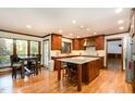 Spacious kitchen with custom cabinets, granite countertops, and a center island at 106 Springbrook Pl, Cary, NC 27518