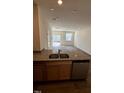 Modern kitchen featuring granite countertops, stainless steel appliances, and open floor plan at 1103 Mountain Crown St, Durham, NC 27703