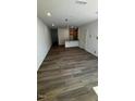 Spacious living room featuring wood flooring and ample natural light, great for entertaining at 1103 Mountain Crown St, Durham, NC 27703