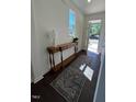 Bright entryway with console table, lamp, and rug, providing a welcoming introduction to the home at 120 Parker Ln, Mebane, NC 27302