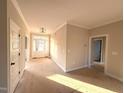 Inviting foyer with bright natural light, neutral walls, and decorative fixture at 1665 S Old Carriage Rd, Rocky Mount, NC 27804