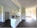 Modern kitchen with white cabinets, a center island with sink, and stainless steel appliances at 1665 S Old Carriage Rd, Rocky Mount, NC 27804