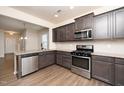 Modern kitchen with stainless steel appliances and granite countertops at 2117 Attend Xing, Fuquay Varina, NC 27526