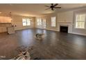 Spacious living room with a fireplace, ample natural light, and open-concept design at 103 Roma Gora Ct, Princeton, NC 27569