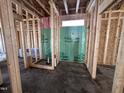 Framed bathroom featuring a window for natural light and visible plumbing at 106 Roma Gora Ct, Princeton, NC 27569