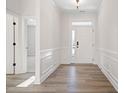 Bright and airy foyer with hardwood floors and wainscoting at 1221 Cricket St, Elon, NC 27244