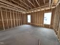 Bedroom featuring exposed beams and natural light from the strategically placed windows at 612 Tuscany Cir, Princeton, NC 27569