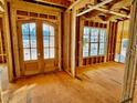 Bright entryway with double doors and wood flooring at 2408 Toll Mill Ct, Raleigh, NC 27606