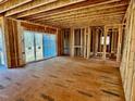 Spacious open floor plan with large windows and hardwood floors at 2408 Toll Mill Ct, Raleigh, NC 27606